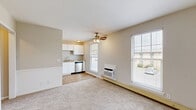 Located at 603 E Northfield Blvd in Murfreesboro, Tennessee, this single-story, two-bedroom, one-bathroom home offers a efficiently arranged floor plan connected by a central hallway. The neutral-toned interior is consistent throughout, creating a cohesive and understated aesthetic.

The kitchen is a functional highlight of the home, featuring crisp white shaker-style cabinetry, light granite countertops, and warm-toned wood-look vinyl flooring. Stainless steel appliances, including a range and dishwasher, complement the clean, modern finish. A window fitted with white blinds brings in natural light, enhancing the bright, open feel of the space.

Both bedrooms feature neutral carpet flooring, white walls, and ceiling fans with light fixtures. The primary bedroom is a comfortable size and includes a closet with double doors. The second bedroom also features a double-door closet, a window overlooking the exterior, and a baseboard heater. Each room maintains a simple, functional character well-suited for versatile furnishing arrangements.

The bathroom is accessed from the hallway and features wood-look vinyl flooring, a tiled tub-shower combination, a granite-topped vanity, and clean white finishes throughout, maintaining the home's consistent, updated aesthetic.