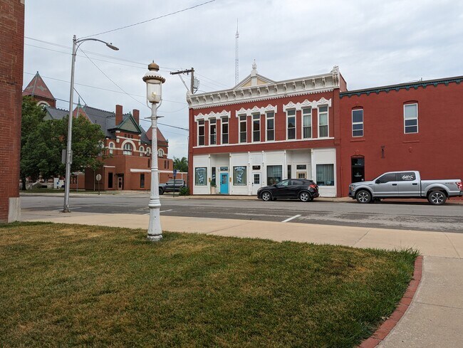 View of building and courthouse next door - 114 S Pearl St