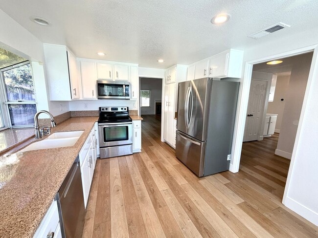 Building Photo - Welcome Home to Prestigious North Upland Living
