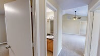 Located at 505 Fox Crossing Blvd in Knoxville, Tennessee, this single-floor, three-bedroom, two-bathroom home offers a well-designed layout with a comfortable flow between living spaces. The living room is a standout area, featuring soaring vaulted ceilings, a ceiling fan, a classic fireplace, and access to an outdoor balcony, creating a bright and airy atmosphere. Neutral-toned carpet runs throughout the main living and bedroom areas, complementing the warm beige walls. The kitchen is efficiently arranged with honey-toned cabinetry, dark granite-style countertops, tile flooring, and a full suite of appliances including a stainless steel refrigerator, electric range, dishwasher, and built-in microwave. A dedicated dining area connects seamlessly to the kitchen and living spaces. The primary bedroom is generously sized, offering ample room and access to a well-appointed bathroom with warm wood cabinetry, a granite-style vanity, and tile flooring. The two additional bedrooms are carpeted and well-proportioned with good natural light. Three closets, including a walk-in with wire shelving, provide excellent storage. A second full bathroom mirrors the quality finishes found throughout the home, rounding out this thoughtfully laid-out residence.