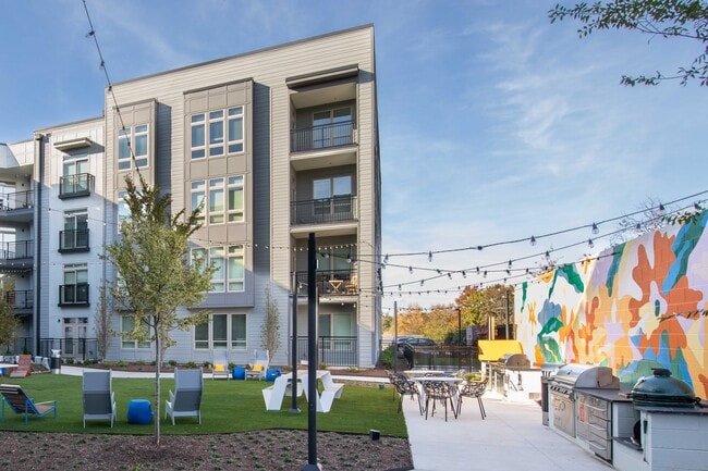 Outdoor Lounge and Grilling Station at UHill Apartments in Durham, NC - University Hill Apartments