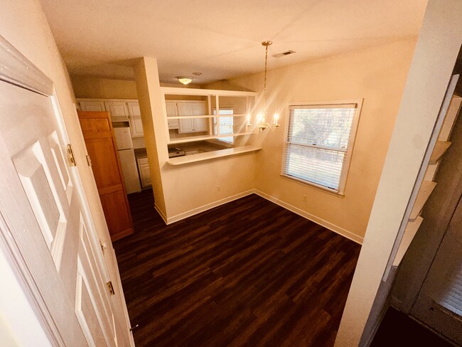 Dining room with kitchen and kitchen bar, also in unit washer and dryer - 245 Willow Ct