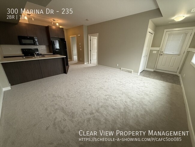 Building Photo - Beautiful 2 bedroom ground floor Condo with New Carpet in Chestermere Station!! ??PROMO: 1ST HALF...