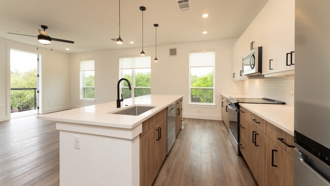 Kitchen with island and hard surface flooring - Lyle