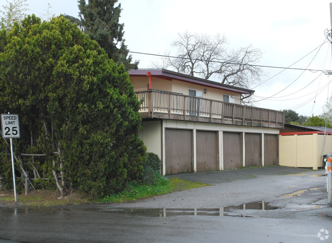 Building cover by big tree. - 840 Mountain View Ave