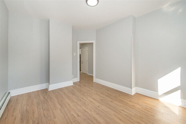 Building Photo - 1703 Manhattan Ave