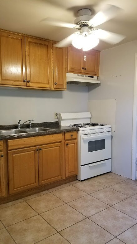 Kitchen includes Stove, Refrigerator - 1301 Grace Ave