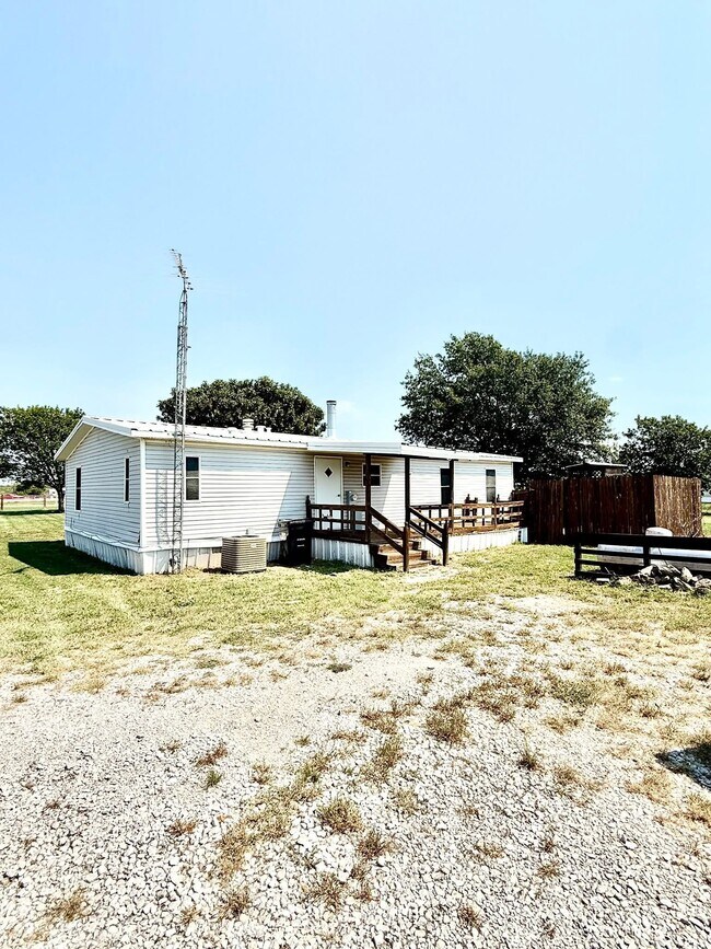 Parte trasera de la casa - 15693 State Highway 205