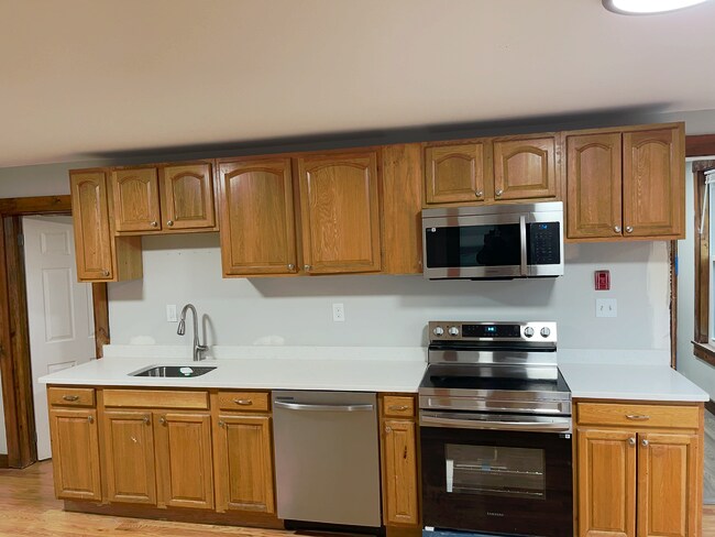 Newly renovated kitchen with stainless steel appliances - 12 Watson St