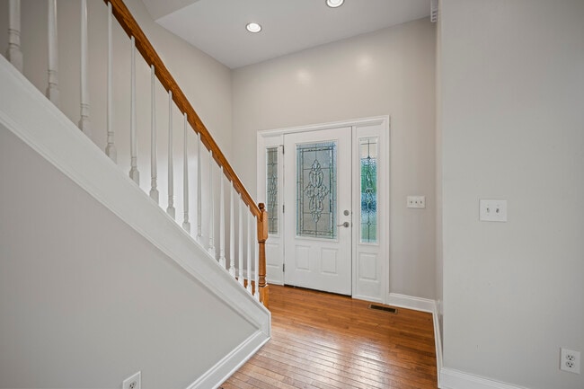 Looking from the Family Room to the Front Entrance and the stairs to Second Story - 393 Hays Blvd