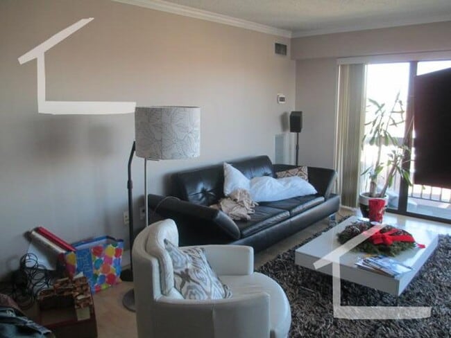Photo - Spacious Top-Floor 2-Bedroom with Heat Included & Garage Parking! Apartment