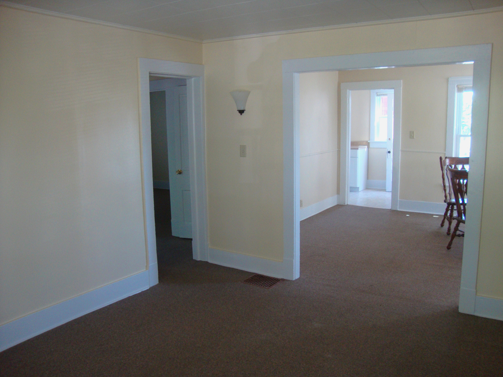 Living Room, Dining Room, and Kitchen from front entry. - 225 College Ave