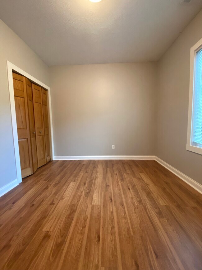 bedroom 1 w/ new vinyl floor - 2620 14th Ave S