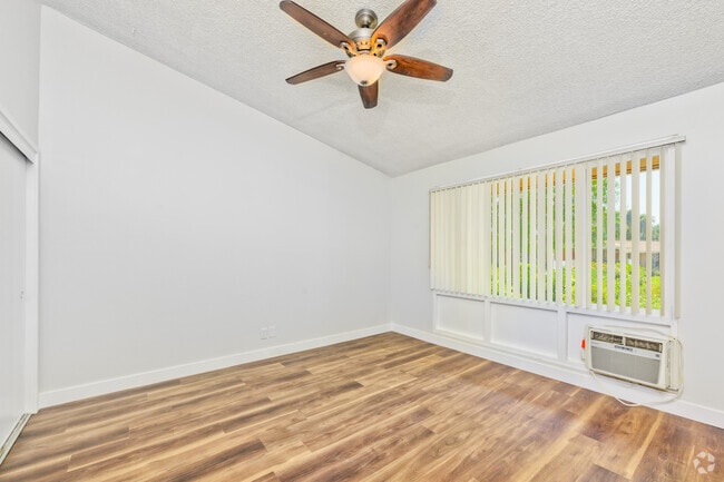 2BR, 2BA - 1,060SF - Primary Bedroom - Village Green Apartments