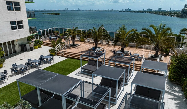 Expansive pool deck with cocktail service and stunning views of Biscayne Bay - Bay Parc
