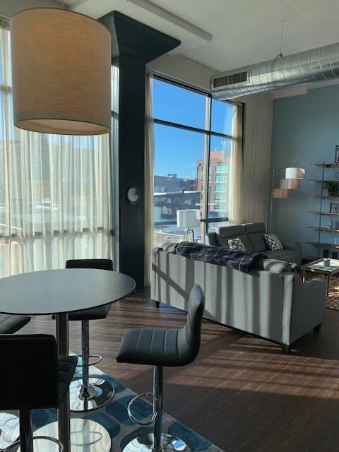 Floor-to-ceiling windows along the entire West wall - 309 E Market St