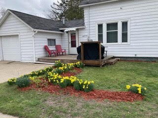 Side view of the house. Patio, grill, and driveway parking - 1047 W Southern Ave