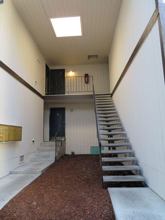 Building Photo - **Welcome to The Magenta Apartments – Luxu...