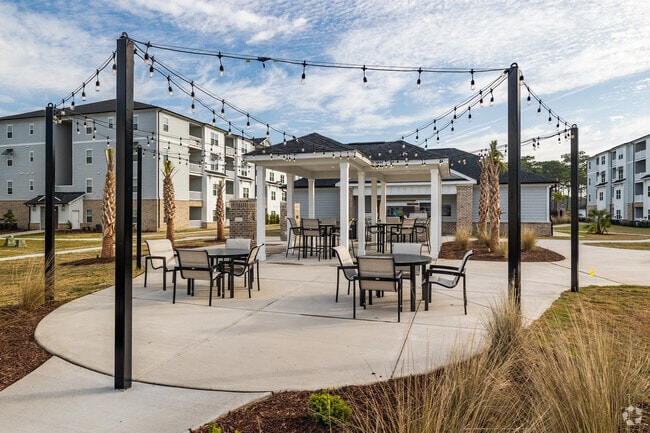 Outdoor Seating Area - The Landings at Grande Dunes Apartments