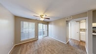 Located at 1773 Wells Branch Pkwy in Austin, TX, this one-bedroom, one-bathroom residence offers a practical and well-appointed single-floor layout. The open living area features warm neutral-toned walls, plush carpet flooring, and a pass-through view into the kitchen, creating a connected and functional living space. A ceiling fan overhead adds comfort and airflow throughout.

The galley-style kitchen is thoughtfully designed with crisp white shaker cabinetry, light stone-look countertops, wood-style flooring, and a full suite of stainless steel appliances including a refrigerator, range, microwave, and dishwasher. A peninsula countertop opens toward the living area, enhancing the sense of flow between spaces.

The bedroom offers a cozy carpeted retreat with two closets providing generous storage, a ceiling fan with light fixture, and a window fitted with blinds that allows for natural light and privacy. Neutral wall tones keep the room feeling calm and versatile.

The bathroom is clean and bright, featuring a white vanity with marble-look countertops, wood-style tile flooring, a window with blinds for natural light, and a full tub and shower combination. The overall aesthetic throughout the unit is cohesive, with consistent neutral tones and modern finishes that create a tidy, move-in ready environment.