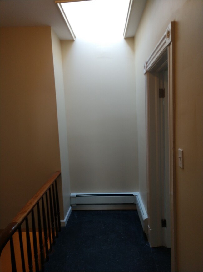 Entry at top of stairs with skylight - 801 Van Duzer St