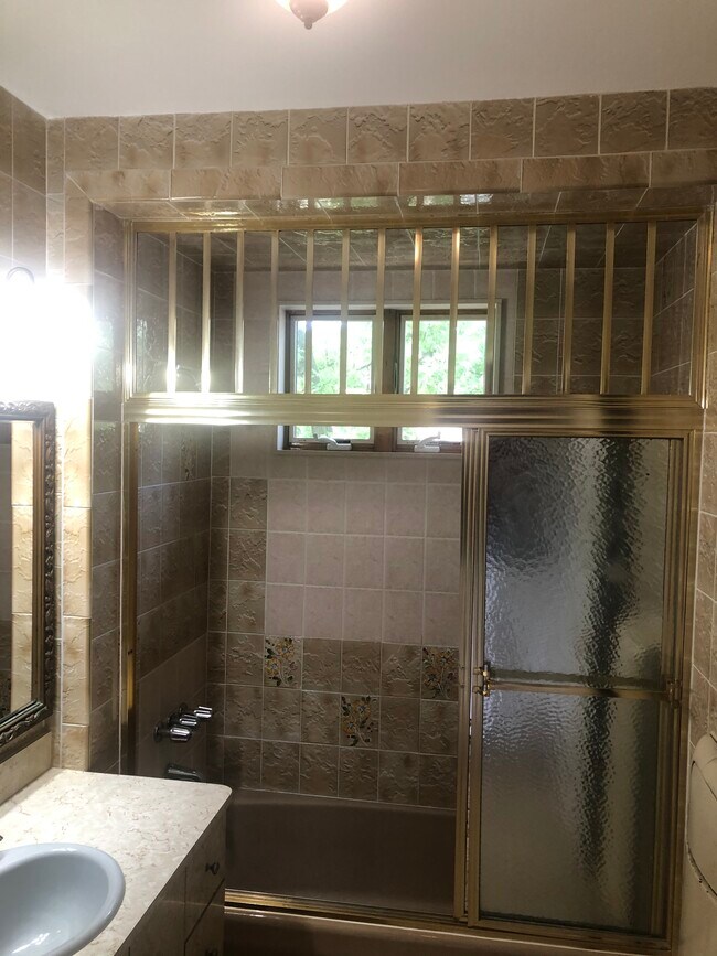 Bathroom with a window - 8701 Bay 16th St