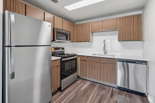 Renovated kitchen with stainless steel appliance package - Azul Apartment Homes