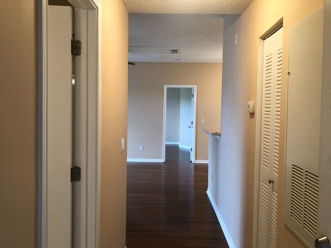 Building Photo - WATER VIEW! 2X2- Spacious 3rd floor condo with tranquil water views from balcony!! Gated Regency ...