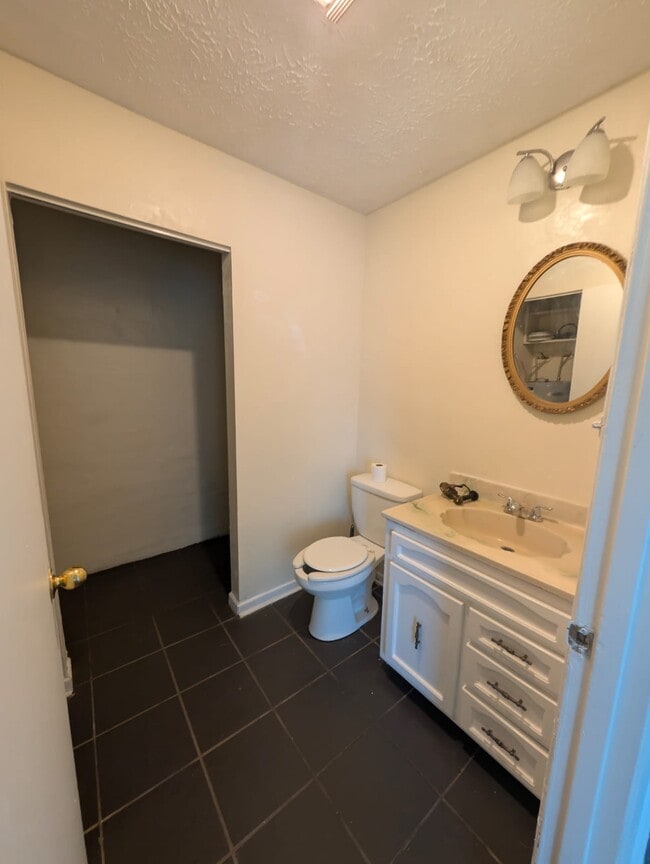 Lower level bathroom + laundry room - 9102 Woodpark Ln