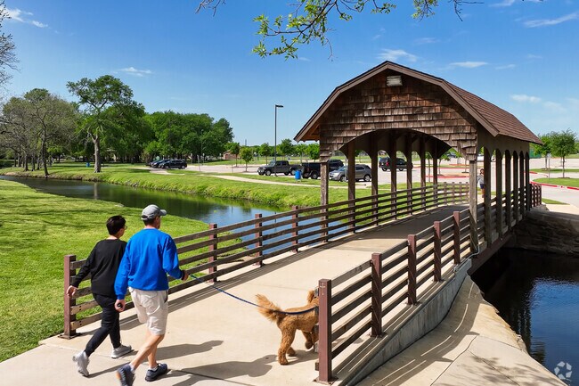 Finished in shingles, the bridge at Bear Creek Park provides residents passage over the creek.