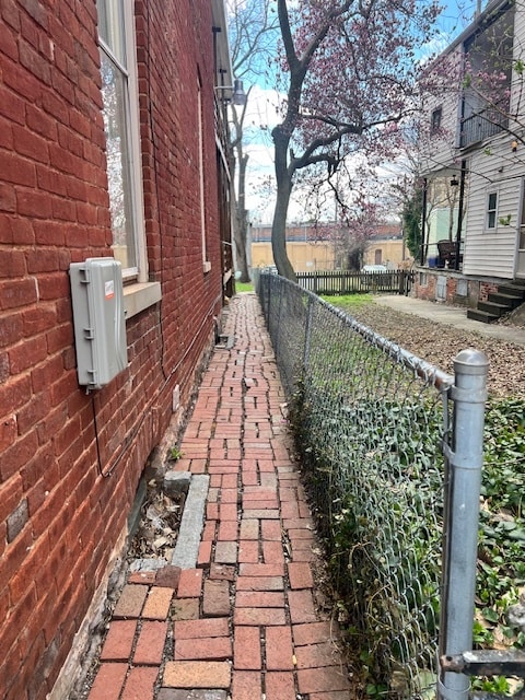 Located on side of bldg - 113 E Franklin St
