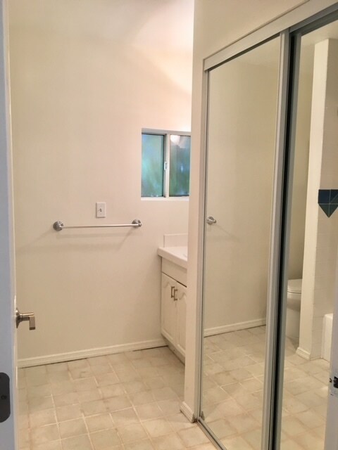 Mirrored closet in bathroom - 3442 Colonial Ave