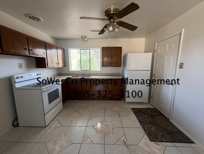 Building Photo - Three Bedroom Home with Garage and Refrige...
