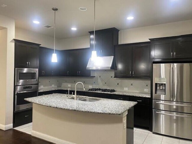 Building Photo - Breathtaking 4-bedroom home in the highly ...