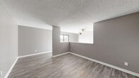 Located at 2600 Colonial Towers Dr in Memphis, TN, this one-bedroom, one-bathroom unit offers a well-organized single-floor layout that makes efficient use of its space. The open living area is a standout feature, showcasing light gray luxury vinyl plank flooring throughout, neutral warm-toned walls, crisp white baseboards, and a textured ceiling. A ceiling fan provides added comfort, while a large window invites natural light and frames a serene wooded view, creating a bright and airy atmosphere.

The kitchen is thoughtfully equipped with white cabinetry, white countertops, a double stainless steel sink, and stainless steel appliances, including an electric range. The layout maximizes functionality within a compact footprint.

The spacious primary bedroom continues the consistent LVP flooring and neutral palette, with a large sliding window offering additional outdoor views and natural light.

The bathroom is a practical highlight, featuring a long dual-sink vanity with white cabinetry and a wide mirror, complemented by a skylight that brightens the space. A dedicated closet and hallway round out the layout, providing storage and a smooth flow between rooms. The overall ambiance is clean, modern, and move-in ready.