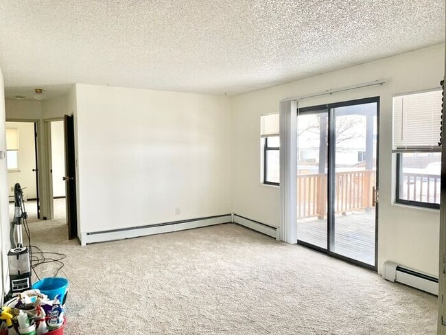 Building Photo - Spacious 2-Bedroom Apartment with Massive Private Deck, Covered Parking & Utilities Included!
