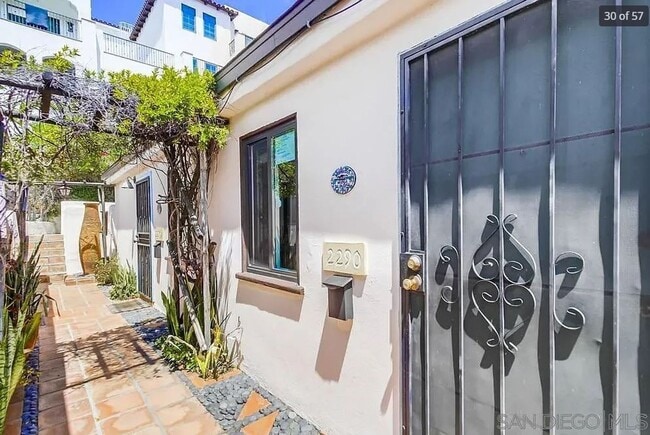 Building Photo - Charming, Fully Furnished Spanish-Style Du...