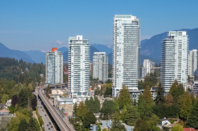 Coquitlam skyline with mountains in the background.