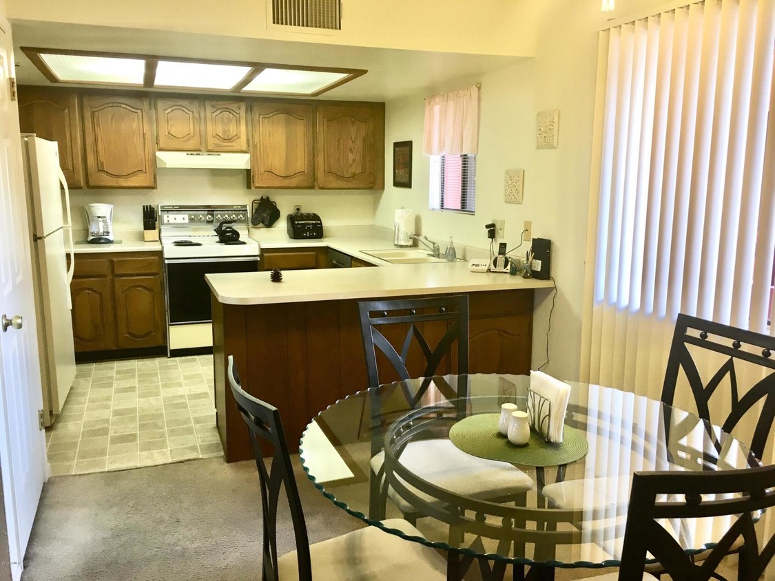 Kitchen and dining area. - 4303 E Cactus Rd