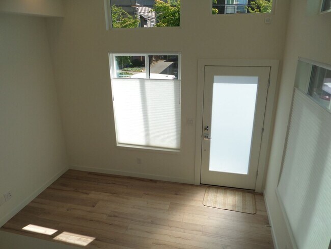 Building Photo - Newer & STUNNING Two Bedroom + Den Condo w...