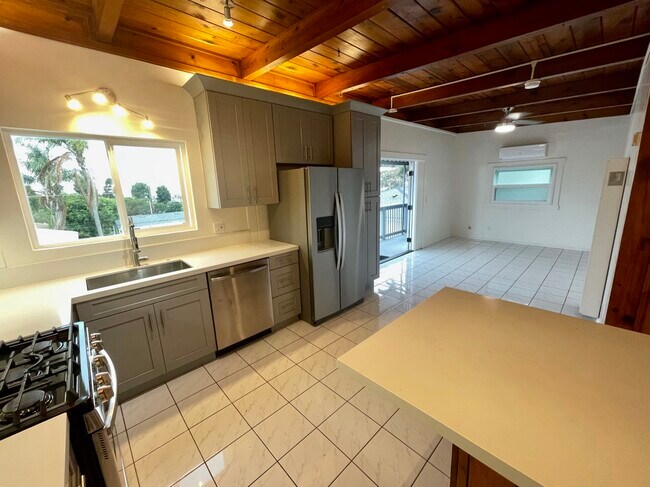 View to living room with brand new A/C unit. - 610 N Horne St