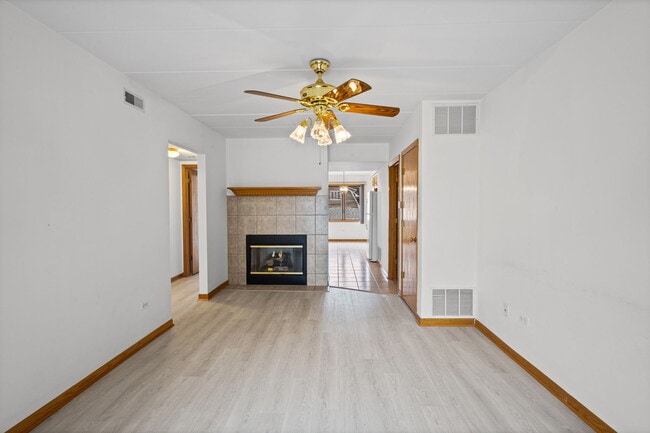 Living room with gas fireplace - 5632 S Narragansett Ave