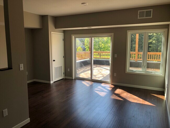 Warm, afternoon sun streams into the living room/kitchen. - 918 Raymond Ave
