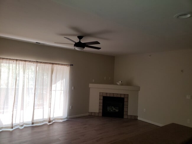 Living room w/ fireplace and deck - 2701 Midland Avenue