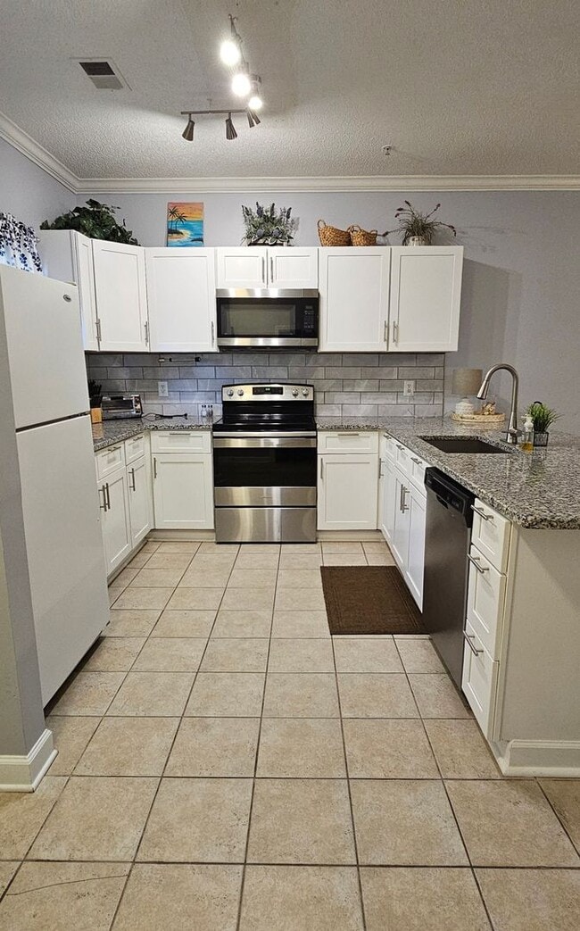 Photo - Stunning First-Floor, Fully Furnished Condo with Pond Views