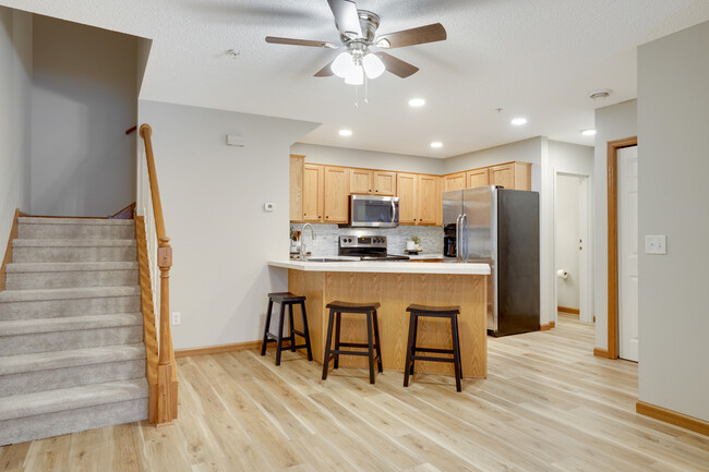 Main level - Kitchen with 1/2 bathroom behind it - 16386 Elm Creek Ln