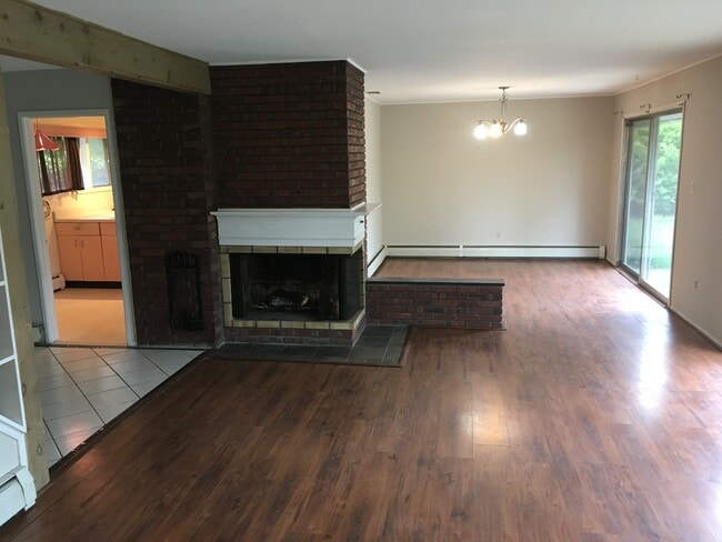 Enjoy formal dinners in the 11'5" x 13' dining room with chandelier mahogany hard wood floors - 35 Red Berry Rd