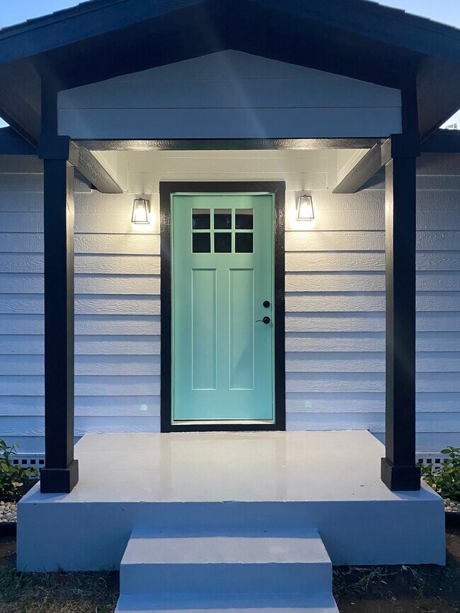 Sea foam green front door - 1209 Perkins Ave