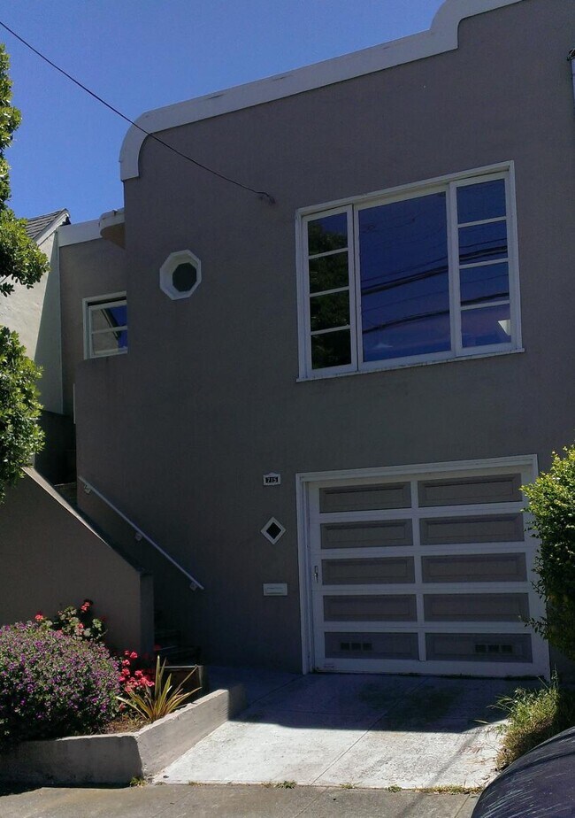 front of house, now with new glass garage door - 715 Grafton Ave