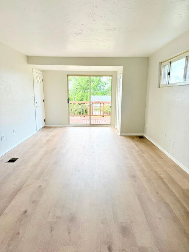 Photo - Newly remodeled 3-bedroom, 1.5-bath home featuring granite countertops, central A/C, and a partia...
